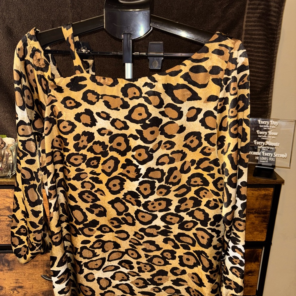 Beautiful leopard print dress; soft pretty cold shoulder; very classy.